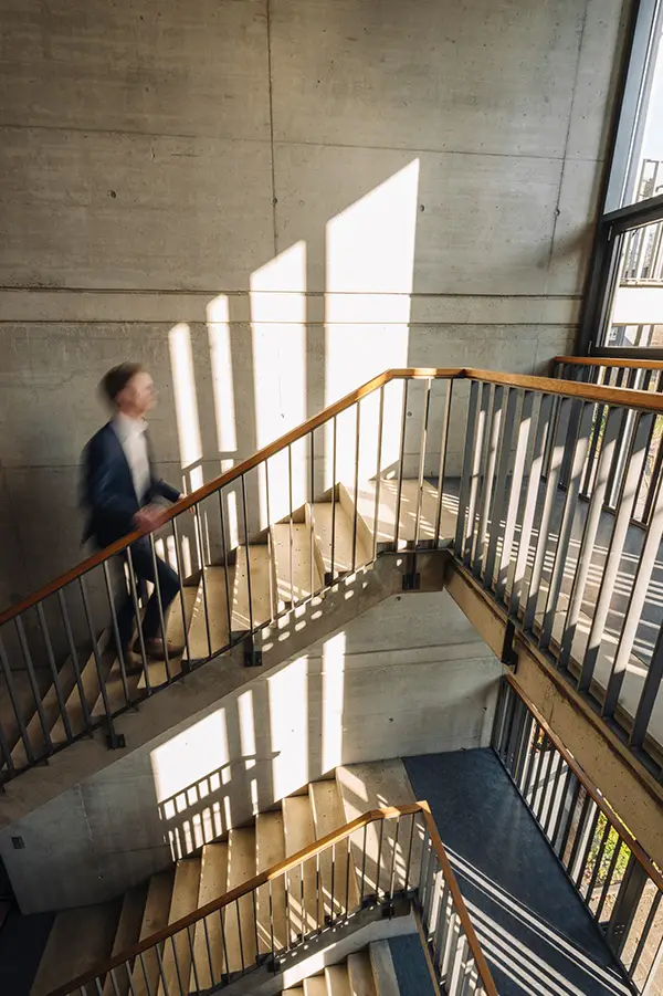 Man on a sunlit staircase
